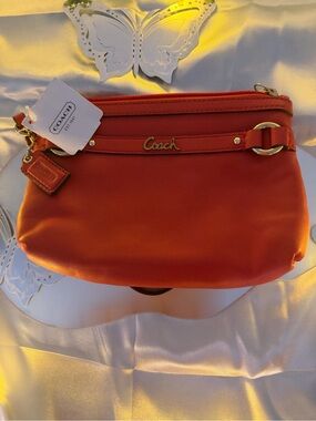 Coach Orange Pebbled Leather Wristlet Clutch